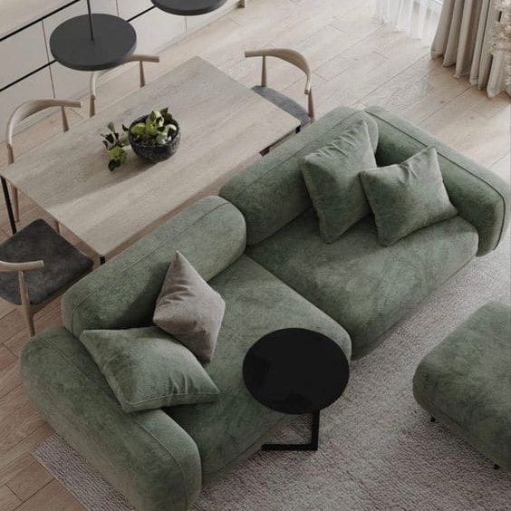 Sala minimalista com sofá verde